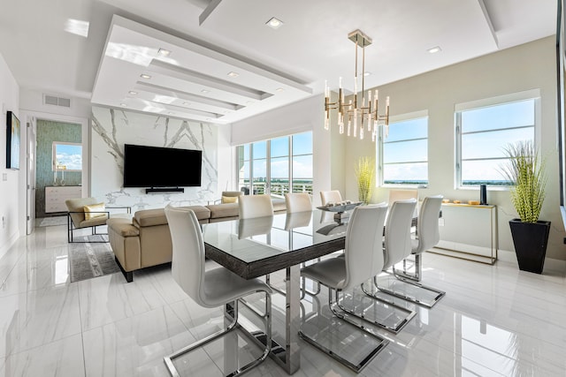 dining space featuring a chandelier