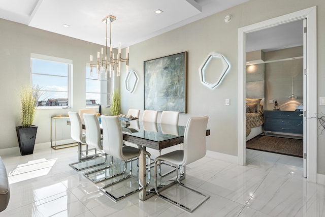 dining area featuring an inviting chandelier