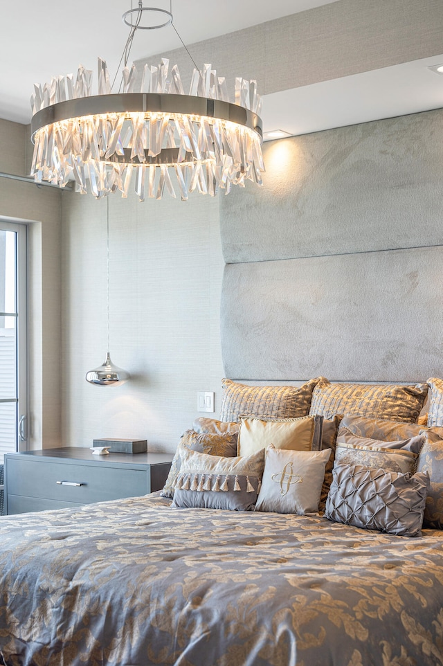 bedroom featuring a chandelier