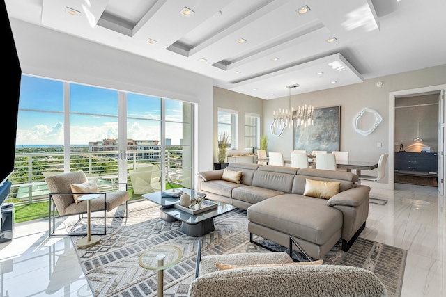 living room featuring a healthy amount of sunlight and a notable chandelier