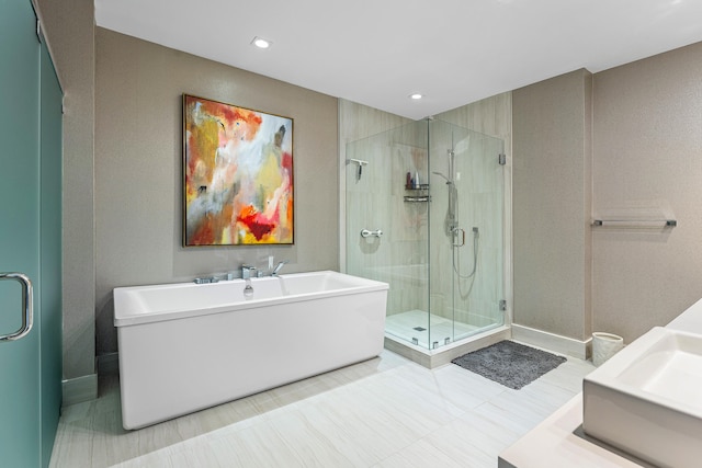 bathroom with vanity, separate shower and tub, and tile patterned flooring