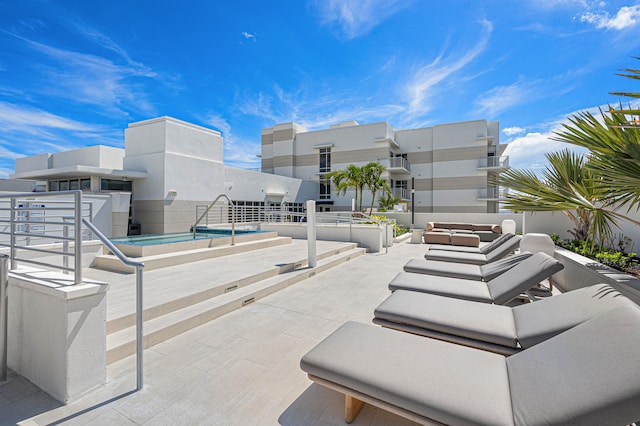 view of patio / terrace with a pool