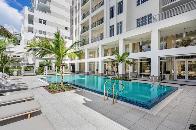 view of swimming pool featuring a patio area