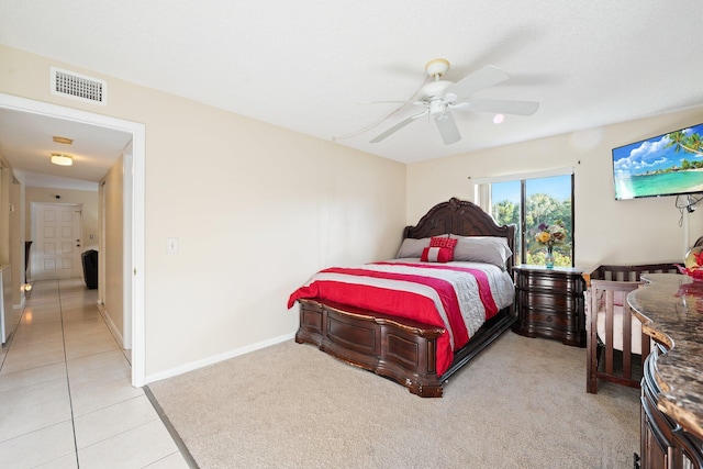 bedroom featuring ceiling fan and light tile patterned floors