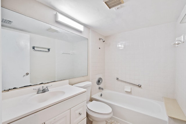 full bathroom featuring tiled shower / bath combo, toilet, and vanity