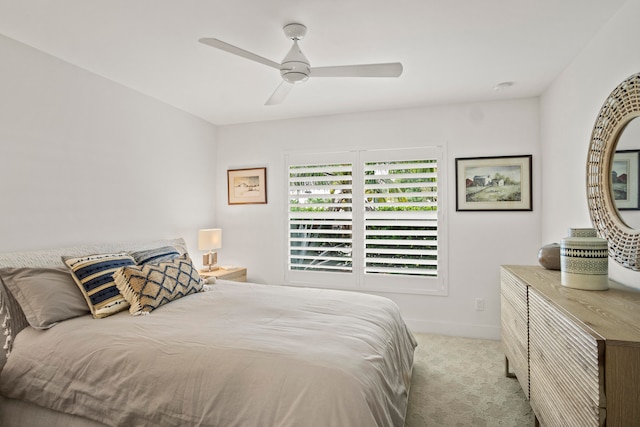 bedroom featuring light carpet and ceiling fan