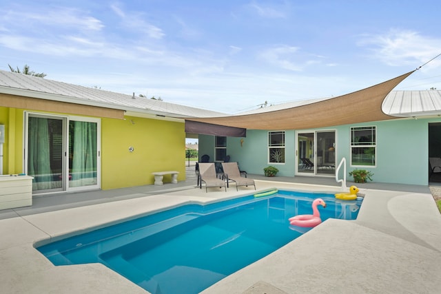 view of swimming pool with a patio