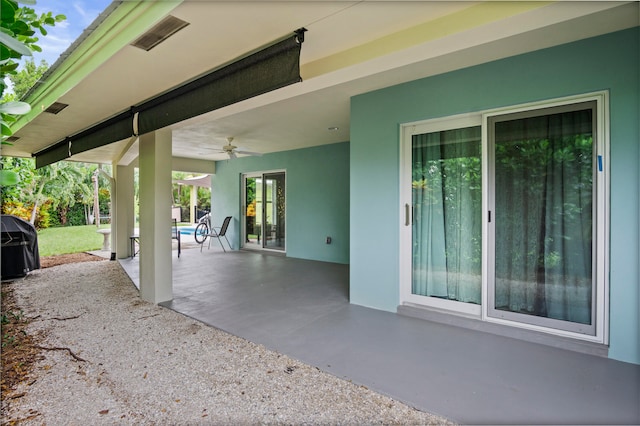 view of patio featuring ceiling fan and grilling area