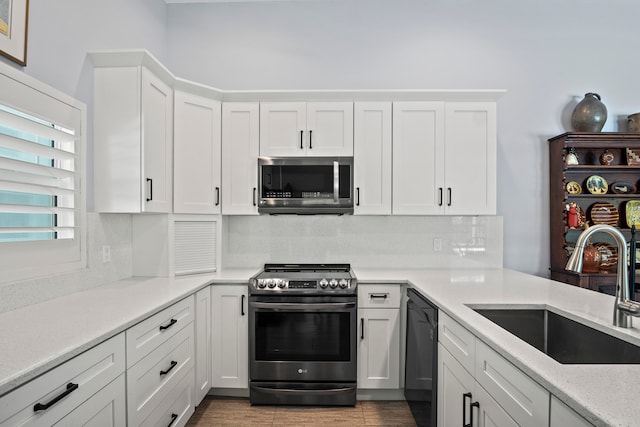 kitchen featuring white cabinetry, sink, and stainless steel appliances