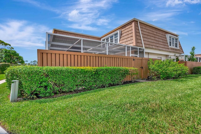 view of property exterior with a yard