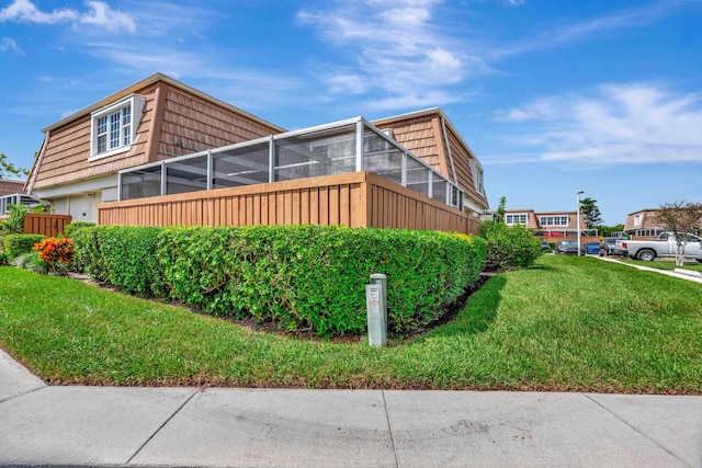 view of property exterior featuring a yard