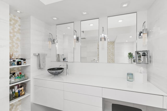 bathroom featuring vanity and an enclosed shower