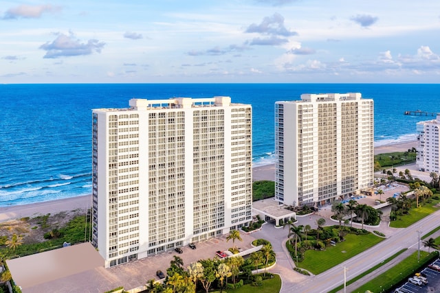 aerial view featuring a view of the beach and a water view