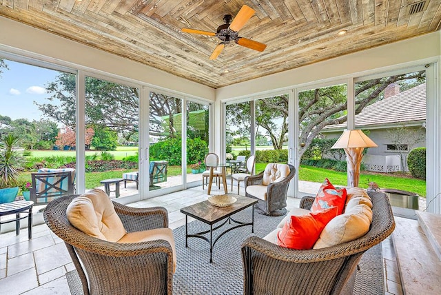 18587 SE Ferland Ct, Jupiter, FL 33469 - sunroom with outdoor lounge area and a ceiling fan