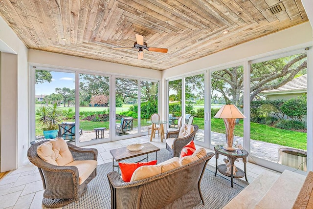 18587 SE Ferland Ct, Jupiter, FL 33469 - sunroom with an outdoor hangout area, ceiling fan, wooden ceiling, and stone tile floors