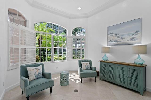 sitting room featuring ornamental molding and light tile patterned floors