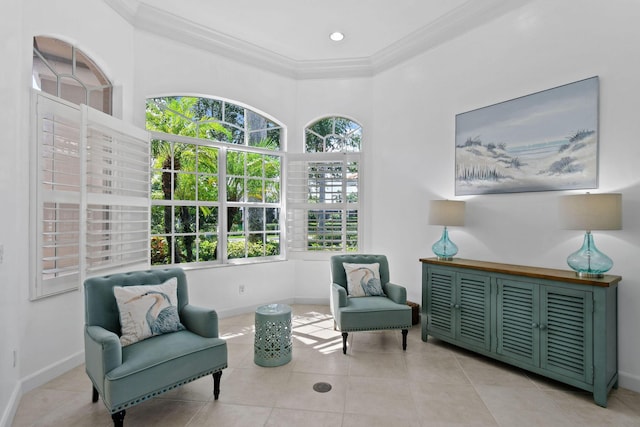 living area with crown molding, light tile patterned floors, and baseboards
