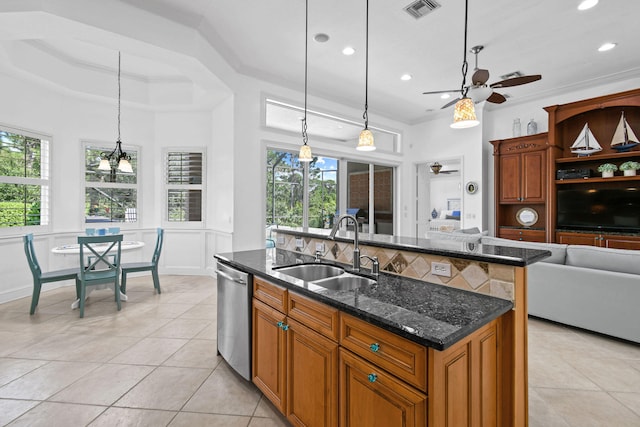 kitchen featuring stainless steel dishwasher, ceiling fan, hanging light fixtures, and sink