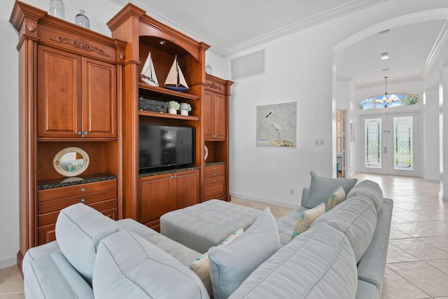 living area featuring arched walkways, ornamental molding, light tile patterned flooring, and a notable chandelier