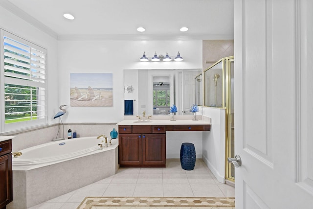 bathroom with a garden tub, a shower stall, tile patterned flooring, and vanity