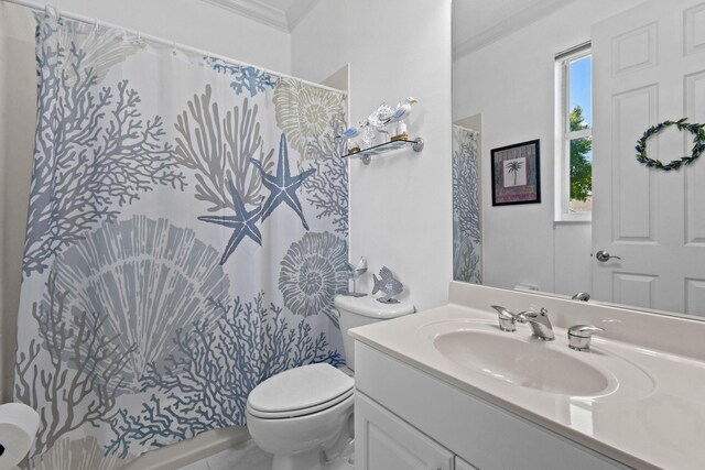 bathroom with vanity, ornamental molding, toilet, and a shower with curtain