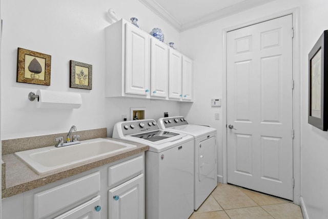 laundry room featuring independent washer and dryer, crown molding, cabinet space, a sink, and light tile patterned floors