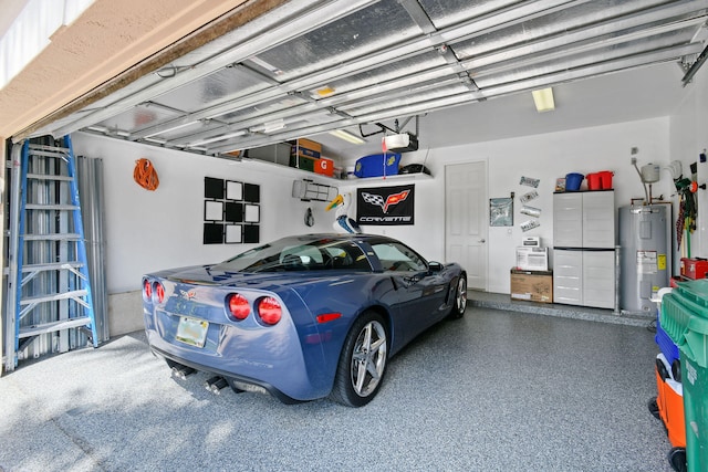 garage featuring a garage door opener and water heater