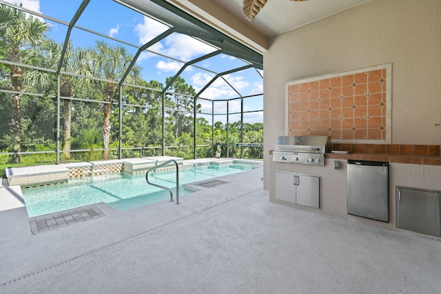 view of pool featuring area for grilling, a jacuzzi, a patio area, a lanai, and exterior kitchen