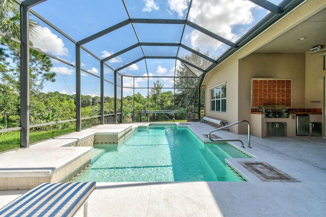 pool featuring an outdoor kitchen, a patio, a grill, and a lanai