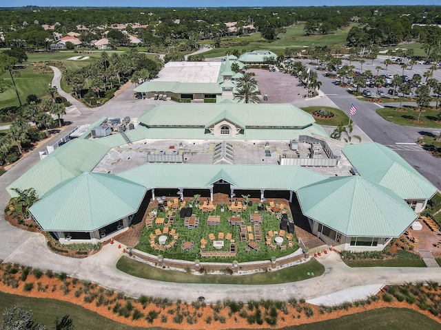 drone / aerial view featuring a residential view and golf course view