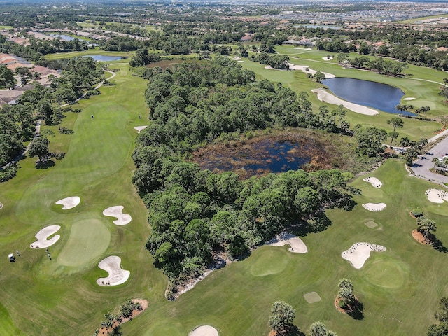 bird's eye view with a water view and view of golf course