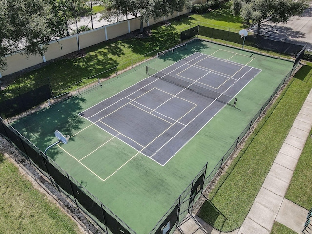 view of sport court with fence