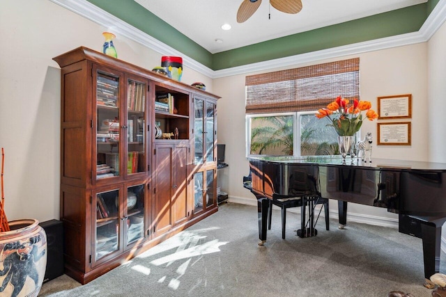 misc room with crown molding, carpet floors, and ceiling fan