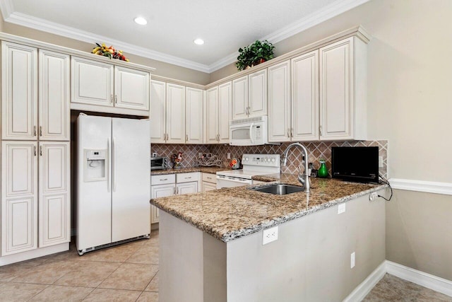 kitchen with sink, light stone countertops, kitchen peninsula, and white appliances