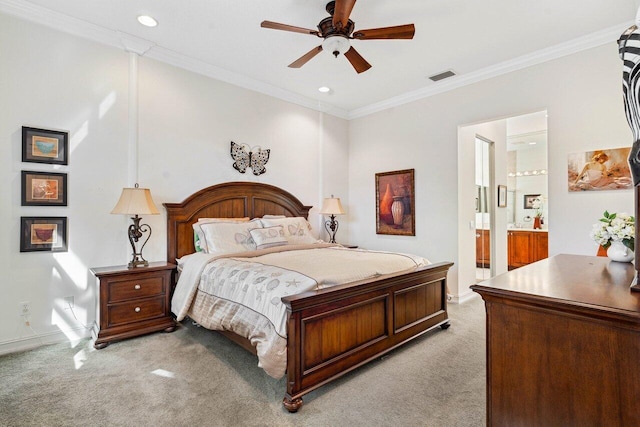 bedroom with crown molding, ceiling fan, light carpet, and ensuite bathroom