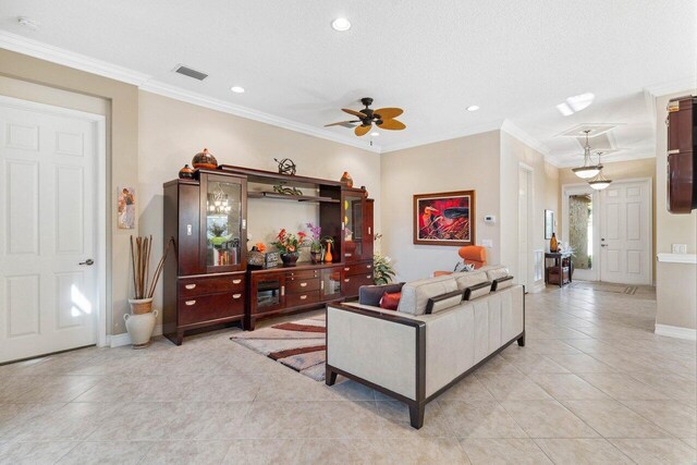 tiled entryway featuring crown molding