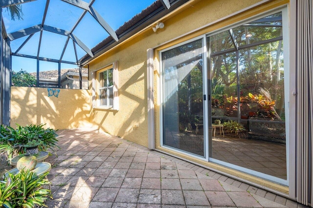 view of patio / terrace featuring a lanai