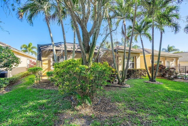 rear view of property featuring a yard