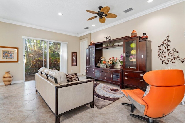 tiled living room featuring ceiling fan and ornamental molding