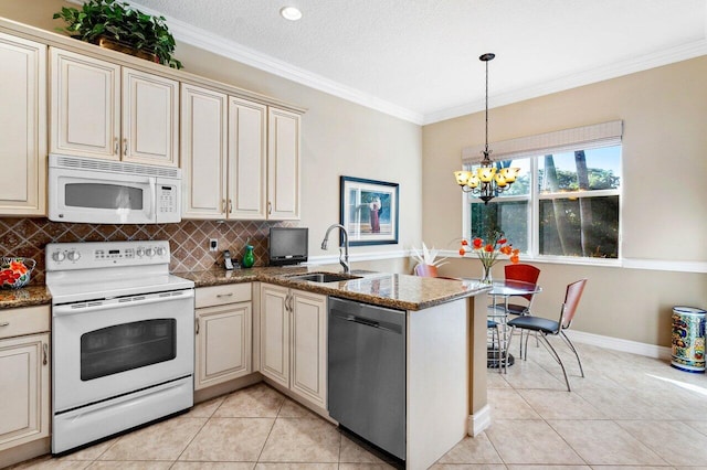 kitchen with sink, crown molding, white appliances, cream cabinets, and kitchen peninsula