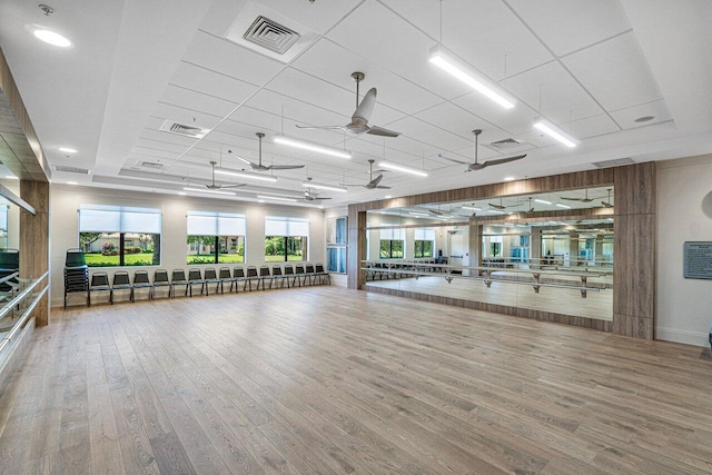 workout room featuring ceiling fan and hardwood / wood-style flooring