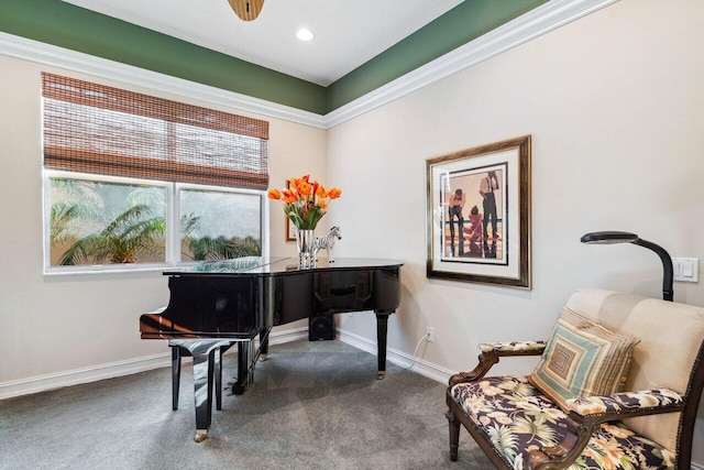 living area with carpet floors and crown molding