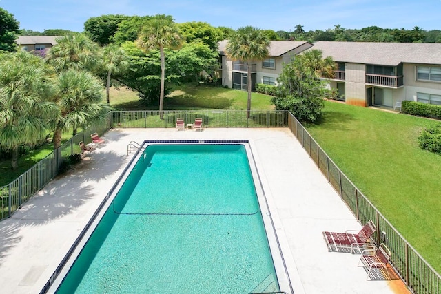 view of pool with a yard and a patio area