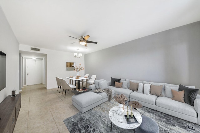 living room featuring ceiling fan and light tile patterned floors