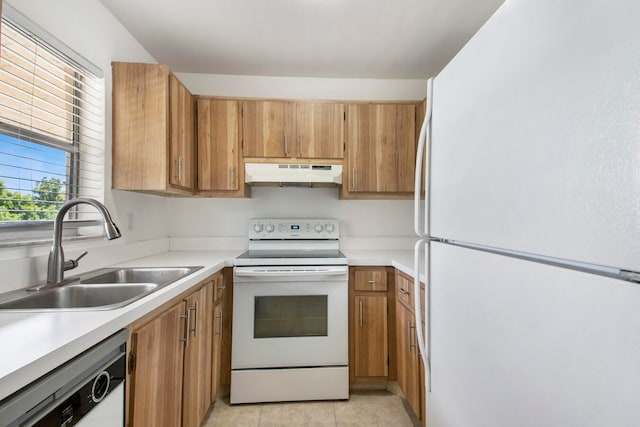 kitchen featuring white appliances, sink, and light tile patterned floors