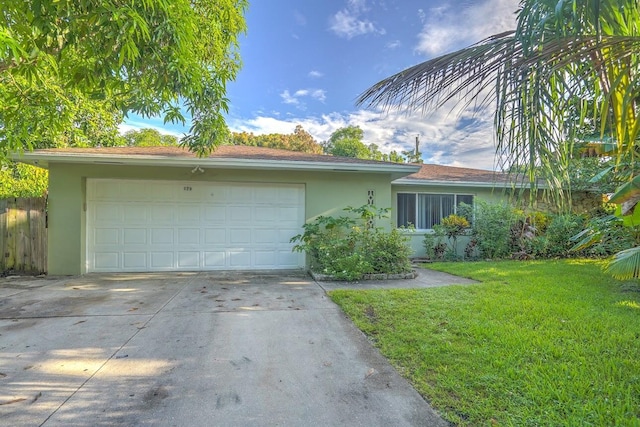 single story home with fence, concrete driveway, an attached garage, stucco siding, and a front yard
