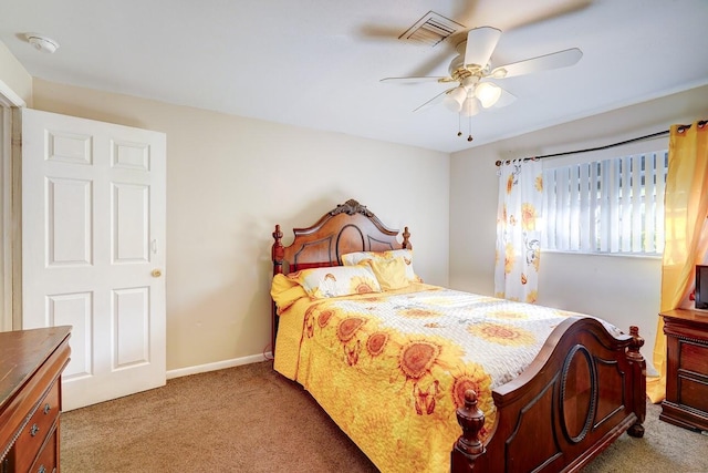 bedroom with visible vents, carpet flooring, baseboards, and ceiling fan