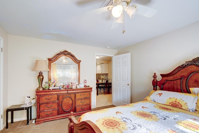 carpeted bedroom with baseboards and ceiling fan