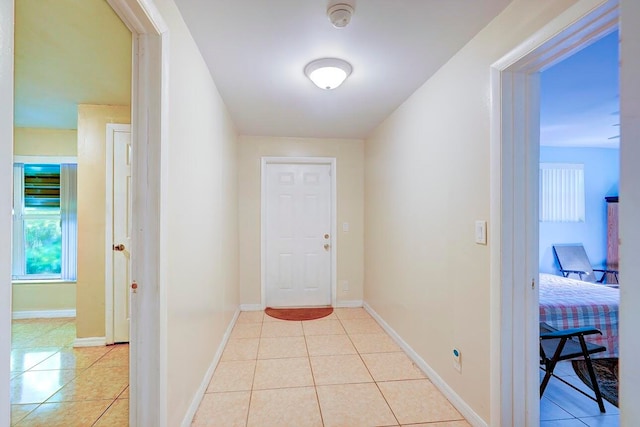 hallway featuring light tile patterned floors