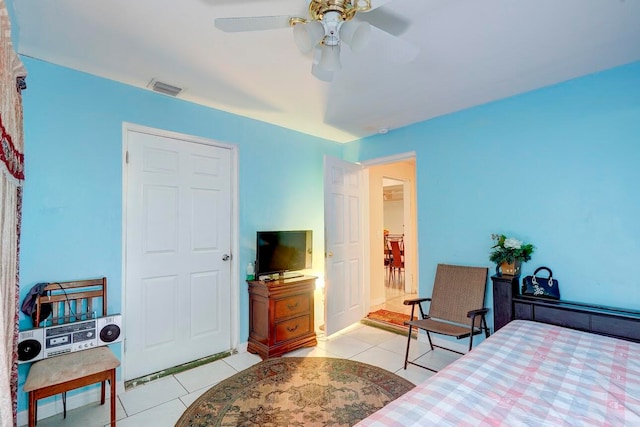 bedroom featuring ceiling fan and light tile patterned floors